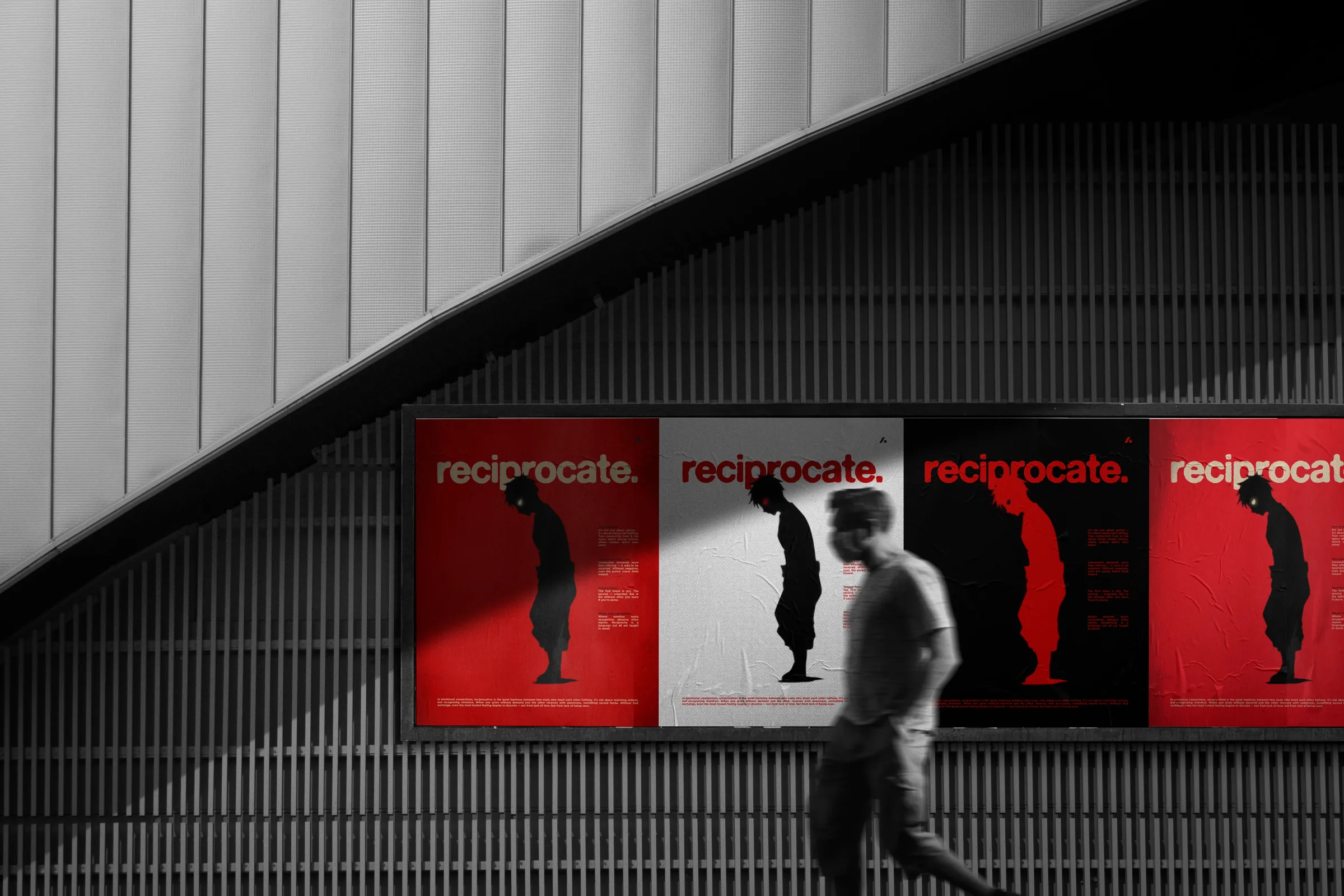Four Reciprocate posters along a curved concrete wall, alternating red and white, a figure walking past.